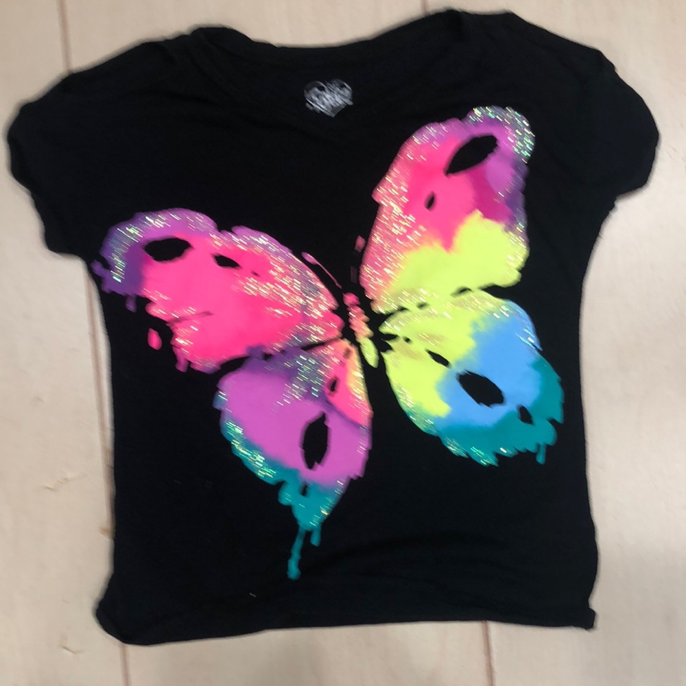 Justice Tshirt - open shoulder short sleeves with colorful butterfly on front.